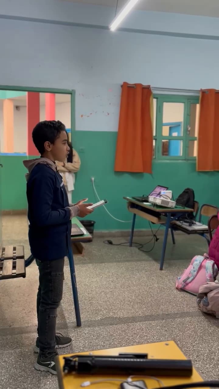 A student speaking in front of the class