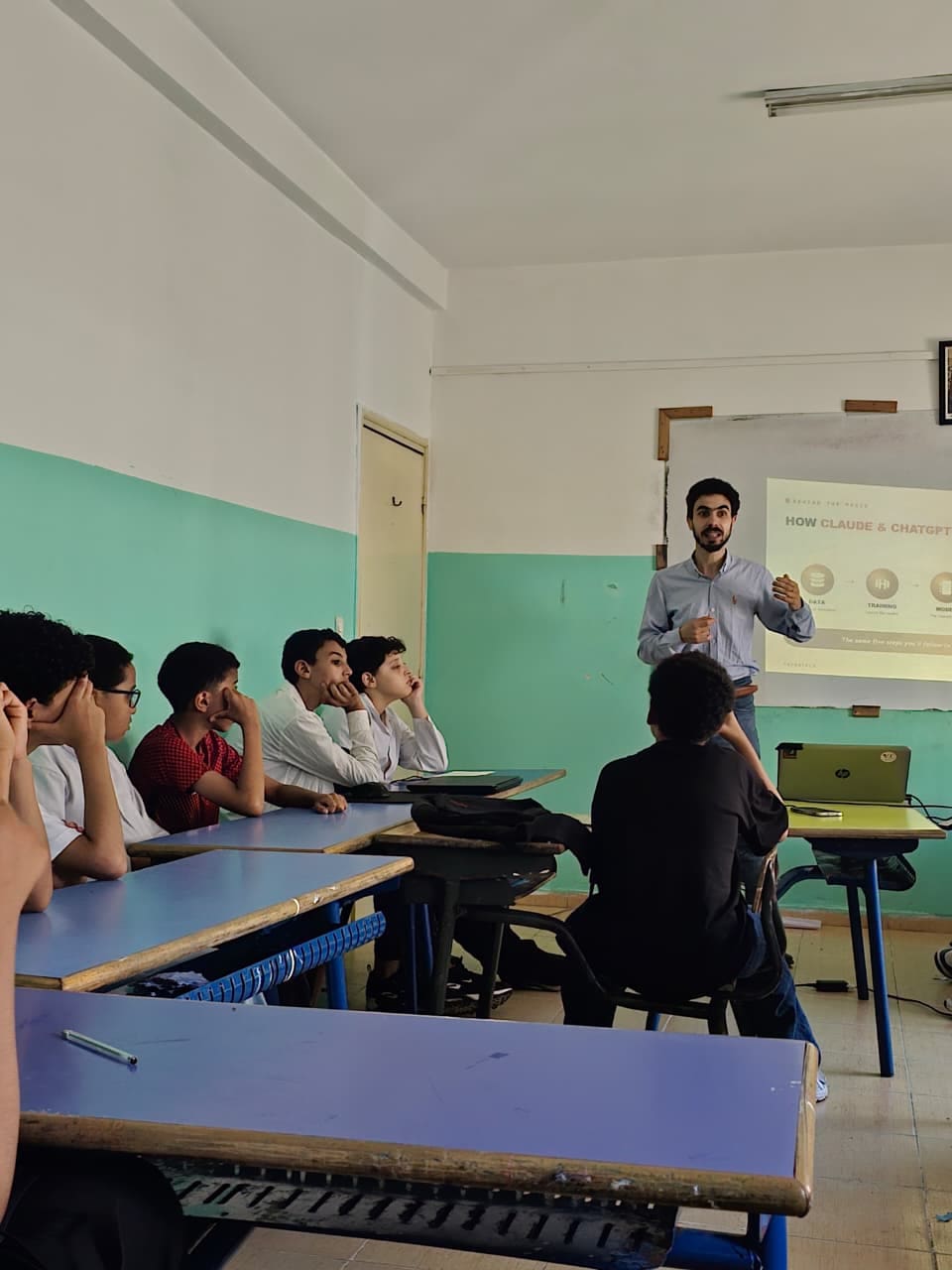 A mentor briefing a class at the start of the Claude Code hackathon